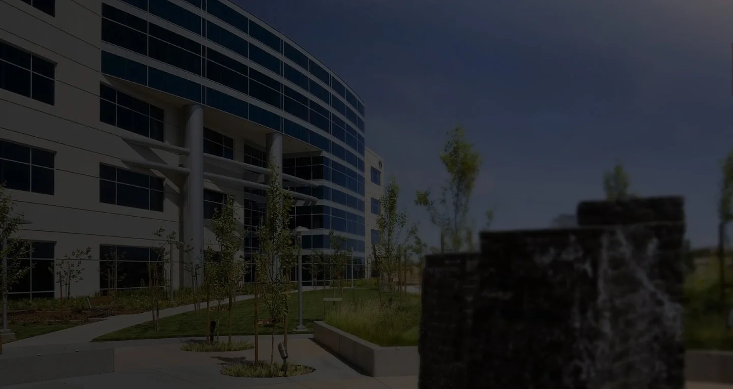 Modern glass office building at dusk